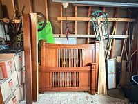 Disassembled bed frame showing headboard, footboard, side piece