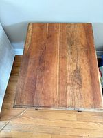 Top view showing solid wood plank surface and finish