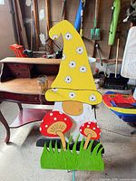 Full view of painted gnome stake showing design and attached stake