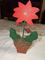 Front view of entire wooden poinsettia decor