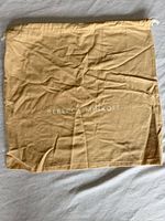 Full view of dust bag front showing size and logo