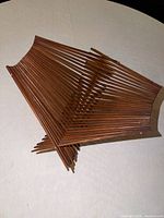 Basket shown expanded, displaying dowel construction