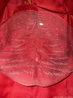 Front view of clear crystal plate showing Christmas tree embossing