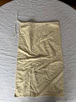 Full view of cream cotton laundry bag