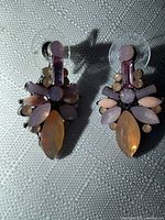 Front view of both earrings showing stone arrangement