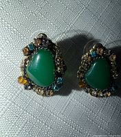 Front view of both earrings showing stones and crystal borders