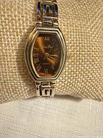 Angled view of watch on cushion