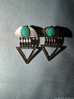 Front view of both earrings showing full design