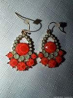 Front view of both earrings showing overall design and stones