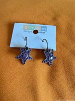 Front view of both star earrings on Bohm card