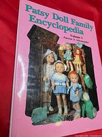 Front cover showing title, author, doll images