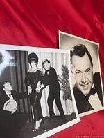 Both photographs shown on red fabric background