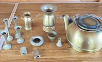 group shot of all brass items on table