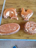 All four copper molds on table