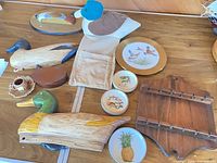 Group shot of duck decor, wooden decoys, plates, wood plaque