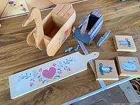 Overview showing both duck planters, cutting board, bird figurines, duck cutout and three plaques