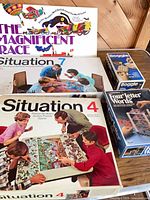 Group shot showing all five board game boxes