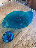 Leaf-shaped platter and small bowl/vase on table