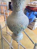 Full view of 21" green relief vase on stand