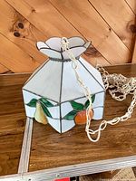 Full view of stained glass lamp shade with chain