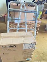 boxed RMS universal elevated toilet seat with folding walker