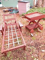 chaise lounge frame and serving cart side by side outdoors