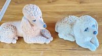 Both Sandicast dog figurines side by side