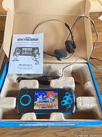 Console, manual, headset and cable inside open original box