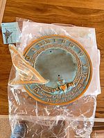 Verdigris cast iron sundial with gnomon in plastic bag