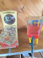 Overall view of both plastic tabletop games on table