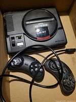 Console and two controllers in box