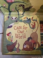Front cover of Care for Our World book inside box