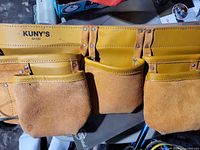 Front view showing Kuny's AP-630 branding and pocket arrangement