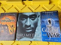 Front covers of the three paperback books