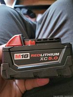 Side view showing M18 REDLITHIUM XC5.0 branding