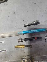 Group view of all five accessories on metal surface