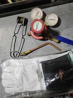 Regulator, torch tip, clamp, packaged gloves overview