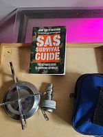 Overall view of book, stove and pouch