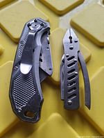 Both items closed: folding utility knife and multitool folded