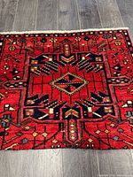 Full view of the rug showing geometric design and colours