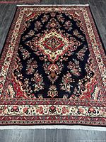 Full view of rug showing entire field and borders