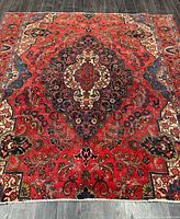 Full view of handmade Persian rug showing overall pattern and colors