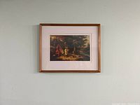 Framed print on wall, showing full frame and matting