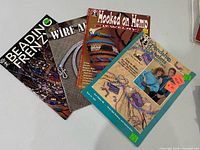 All four instructional booklets laid out showing front covers