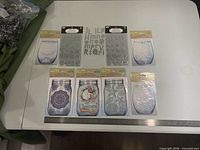 All nine sealed packs laid out on table