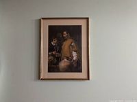 Front view of framed print hanging on wall