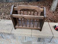 Overall view of wooden magazine rack on retaining wall