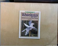 Front cover of softcover book showing title, author and Pegasus whirligig image