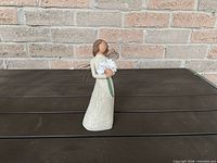 Front view of figurine showing design details