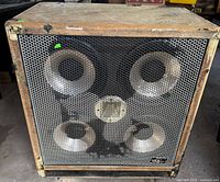 Front view showing four 10-inch speakers and grille